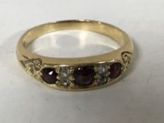 An 18ct gold ruby and diamond ring, size N, 3.