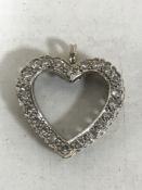 A white gold diamond set heart pendant, 3.