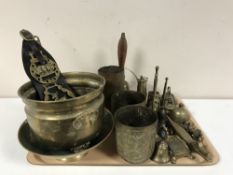 A tray containing a large quantity of assorted brassware including shell casing, hand bells,