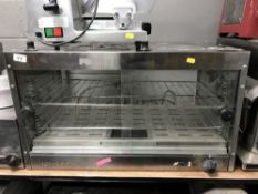 A stainless steel counter top food warmer