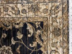 A fringed Ziegler carpet 230 cm x 160 cm on blue ground