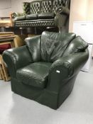 A green leather armchair