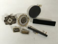 A good collection of seven Victorian brooches, mourning brooch, gold mounted locket etc.