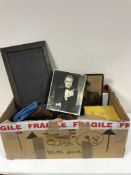 A box of five copies of Trivial Pursuit, cameras, mid 20th century building kit,