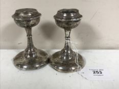 A pair of silver candlesticks