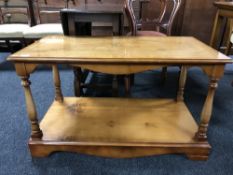 An inlaid yew wood coffee table