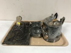 A tray of three piece pewter tea service, toast rack, coffee pot,
