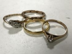 Four rings - 9ct gold with diamond solitaire, 22ct gold band,