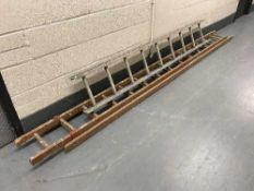 An aluminium ladder together with a wooden extending ladder