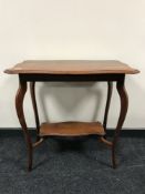A shaped Edwardian mahogany occasional table