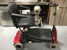 A Esolex disability cart with charger and cover