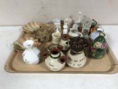 A tray of crested pieces, Devon ware china, copper lustre, pair of shell dishes,