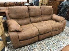 A brown suede three seater reclining settee, width 207 cm,