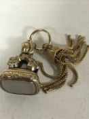 A Victorian hard stone fob with gold tassel fob