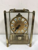 A brass cased anniversary clock