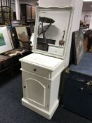 A painted beside cabinet fitted a drawer and a painted framed mirror