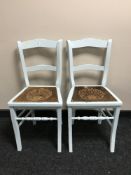 A set of four painted kitchen chairs