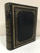 A leather bound volume : The Pilgrims Progress Holy War by John Bunyan