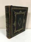 A leather bound Family Self Interpreting Bible by The Rev.