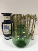 An ornate metal stickstand and a brass stickstand, three walking stick, one with silver mounts,