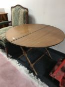 A circular folding campaign table