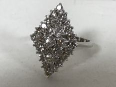 A diamond cluster ring, set with 29 brilliant-cut diamonds in a marquise setting,