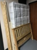 A 4'6 pine bed and 4' mattress