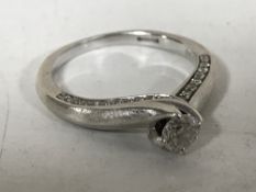 A 9ct white gold Canadian Ice diamond solitaire ring, in retail box with certification.