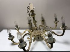 A heavy brass eight branch chandelier
