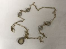 A fine Victorian crystal backed 'shell' locket with seed pearl border,