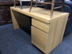 A contemporary single pedestal desk