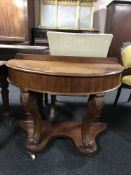 A Victorian mahogany d-shaped table