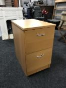 A beech two drawer filing chest