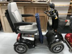 A Sterling Diamond disability cart with key,