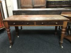 A Victorian mahogany side table fitted with two drawers.