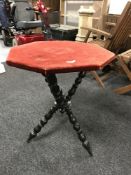 An octagonal occasional table on three way support
