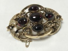 Large and impressive Victorian gold brooch set with cabochon garnets