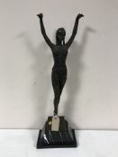 After Chiparus - A bronze dancing figure on stepped marble plinth, height 64 cm.
