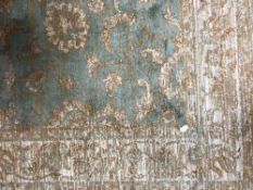 A fringed Ziegler carpet 190 cm x 140 cm on green ground