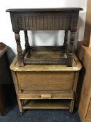 An oak sewing trolley and an oak side table