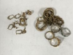 An assortment of loose 9ct gold earrings, together with a quantity of dress rings, earrings,
