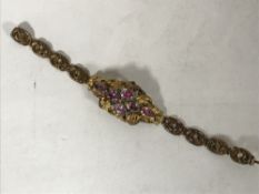 A Georgian gold cuff bracelet set with pink sapphires and emeralds, length 17.5 cm, 14.8g.