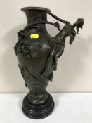 A bronze vase on marble socle with maiden and branch decoration, height 38.