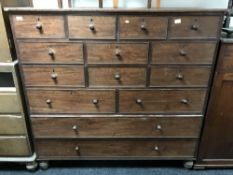 A Victorian pine sixteen-drawer chest.