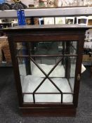 A late 19th century mahogany glazed door curio cabinet