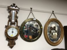 An oval gilt framed etched mirror,
