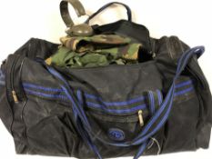 A large holdall containing army DP clothing