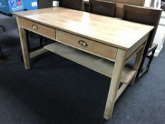 An antique pine kitchen table fitted two drawers