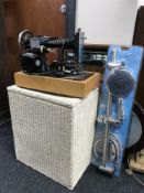 A Singer electric sewing machine, loom s/l box, three framed mirrors,