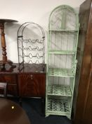 A metal five tier shelving unit and a metal wine rack